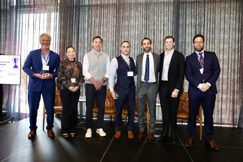 Group of professionals at a Scale Community Events award ceremony, showcasing networking and recognition, only available at Scale Community Events.