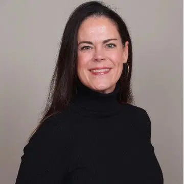 Headshot of a professional woman in a black top, showcasing networking opportunities at Scale Community Events.