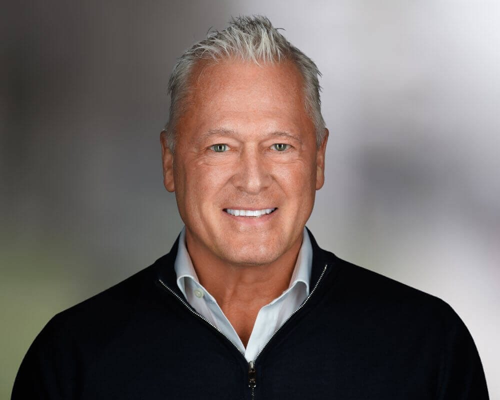Headshot of a smiling individual, showcasing professional demeanor, only available at Scale Community Events.